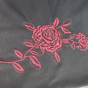 Black skirt with embroidered red rose